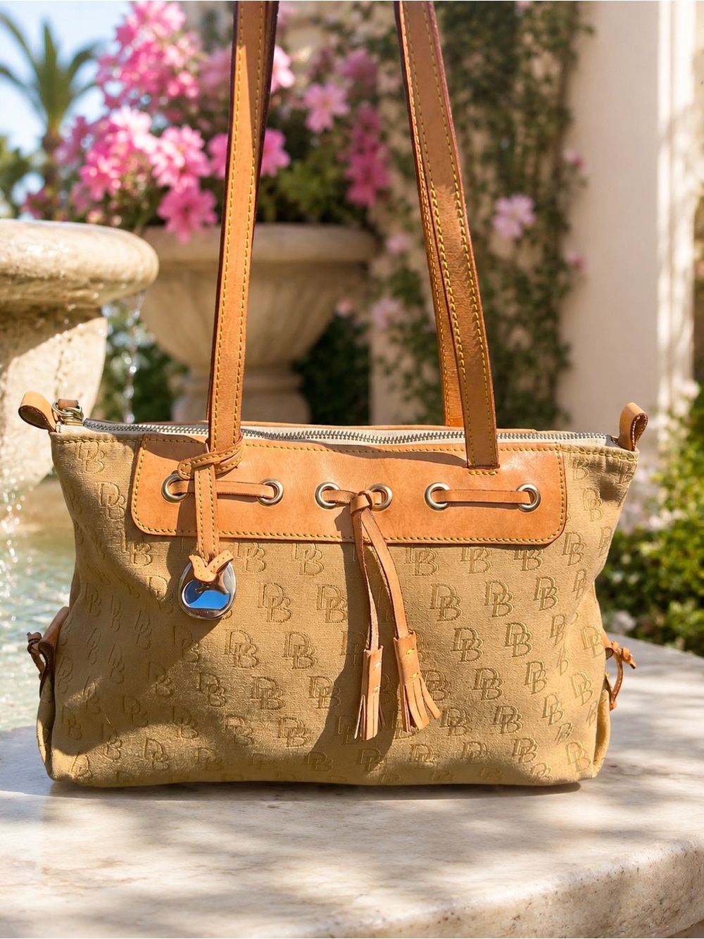 Dooney & Bourke DB Tassel Zip Top Tote Sand Tan Canvas Saddle
Tan Leather - Picture 4 of 14